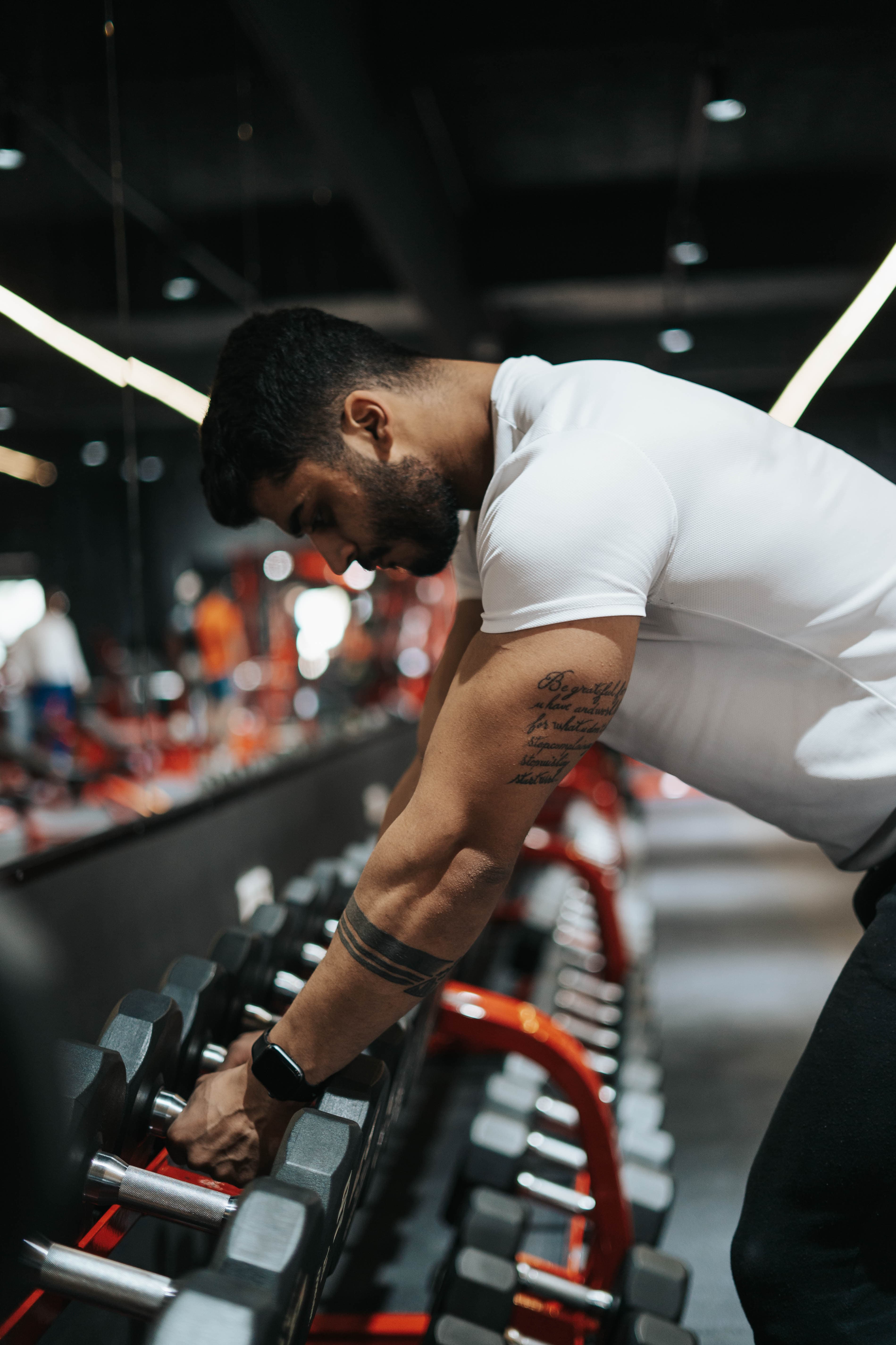 Omar performing a barbell curl